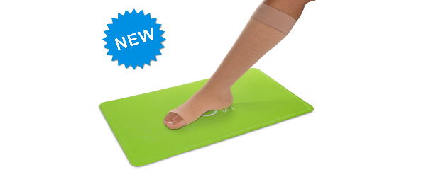 Woman positions support stocking using the Steve Mat anti-slip mat